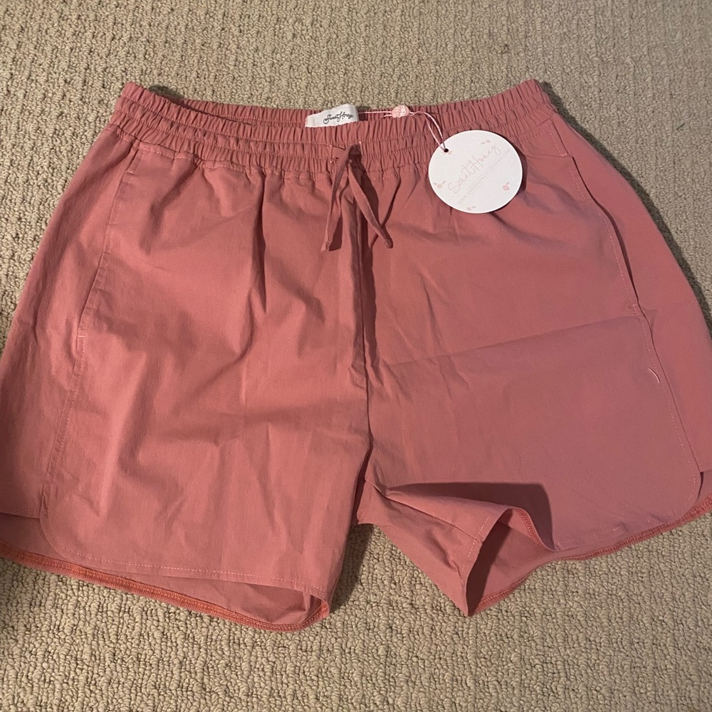 Sweet Honey athletic mom shorts in rosy pink. With pockets and fully lined. NWT.